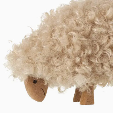 Fluffy Sheep Ornament a unique ornament. This woolly sheep is no exception. It's a stylish home accessory that adds a fabulously quirky touch to any room.